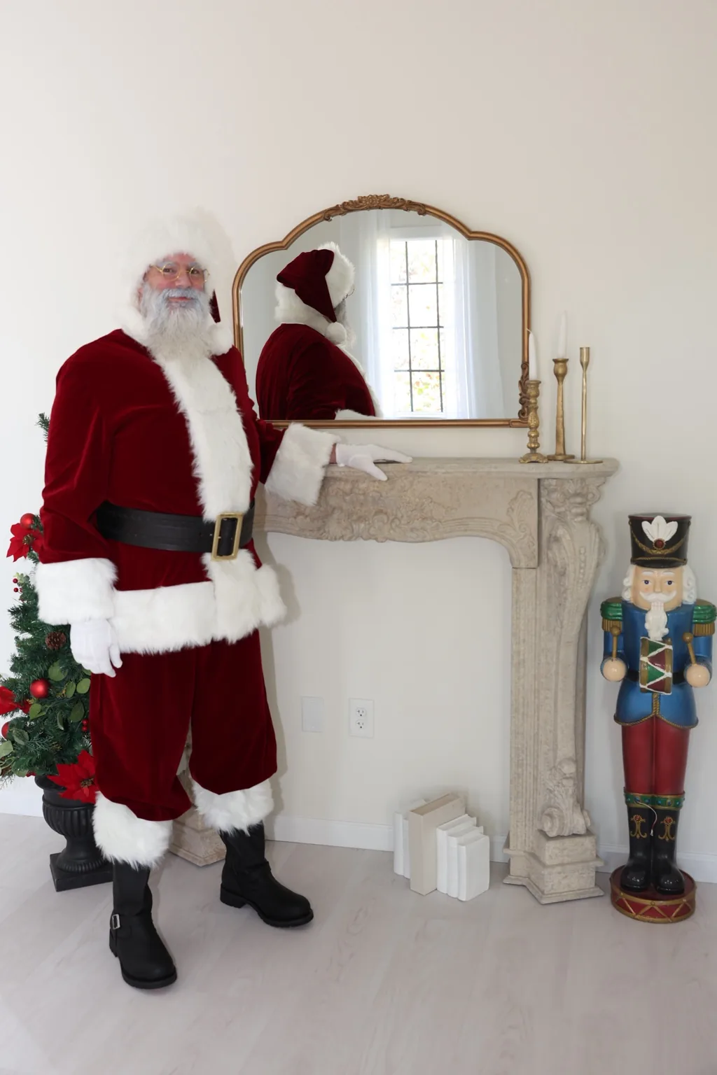 Santa standing beside a traditional mantel